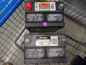 Junked up car battery, along with its unnecessarily expensive replacement.